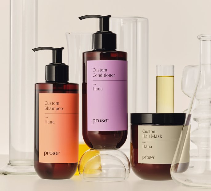 Prose Custom Shampoo, Conditioner and Hair Mask among lab glassware