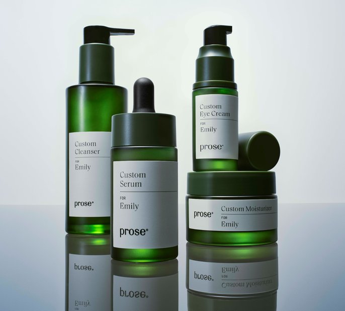 Prose Custom Cleanser, Serum, Eye Cream and Moisturizer on a reflective surface